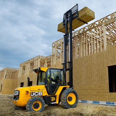 Forklift unloading machinery and industrial equipment in Borehamwood